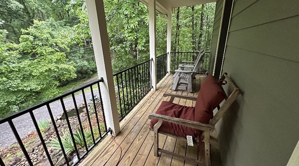 Front porch offers peace and view of wooded acreage