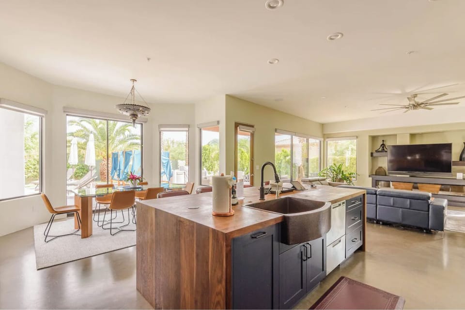 The kitchen island with dining room on the left and family room to the right.