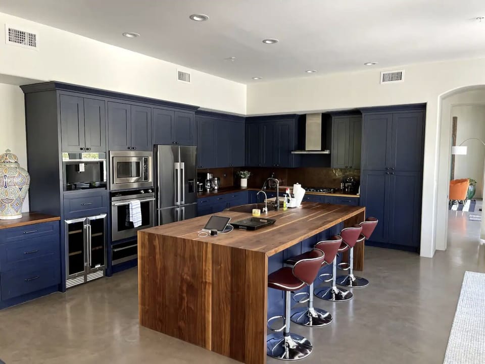 Gourmet kitchen with Brazilian cherry countertops and copper backsplash/sink