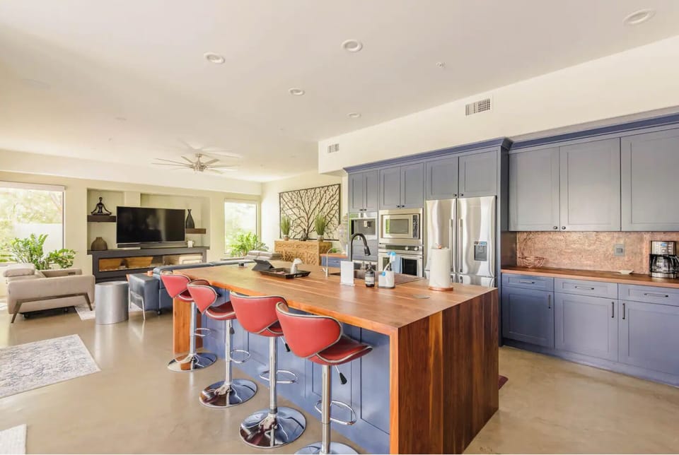 Gourmet kitchen with Brazilian cherry countertops and copper backsplash/sink