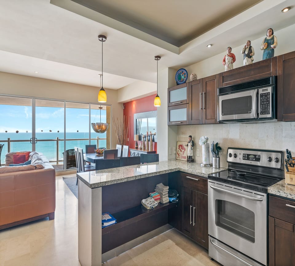 Family Condo | Private kitchen | Fridge, dining tables