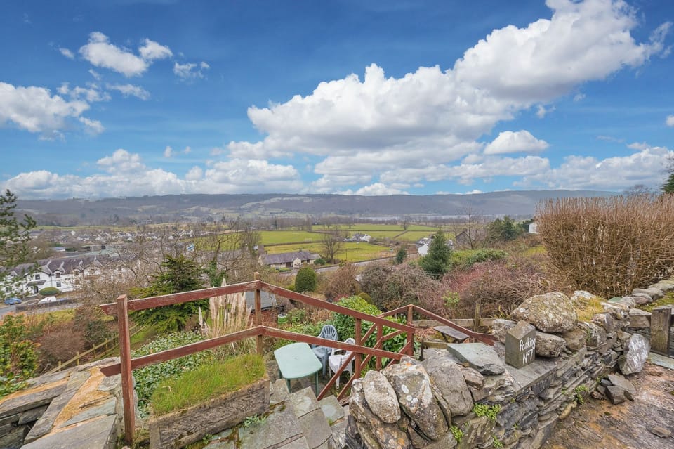 Steps down to Rose bank Cottage garden with lake views
