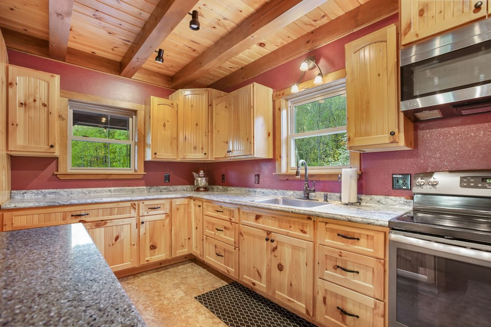 This spacious kitchen has enough counter space for those times when many "cooks are in the kitchen", so to speak :)