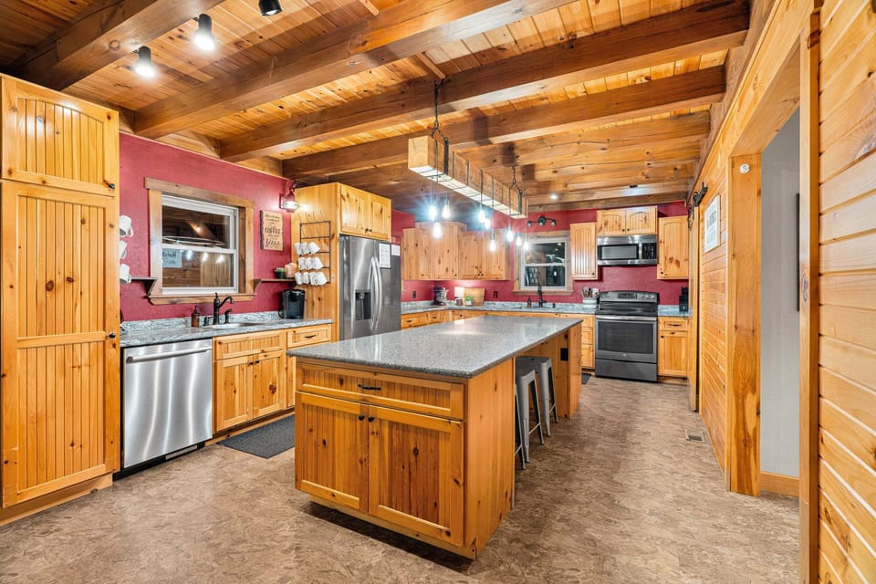 This kitchen is fully-equipped with all of your cooking needs for your stay! This large island has 3 stools, and is the perfect spot for displaying all of your tasty dishes for the crew!