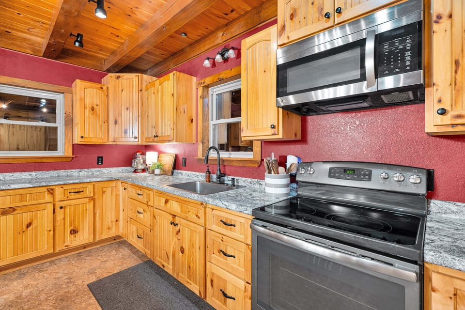 This spacious kitchen has enough counter space for those times when many "cooks are in the kitchen", so to speak :)