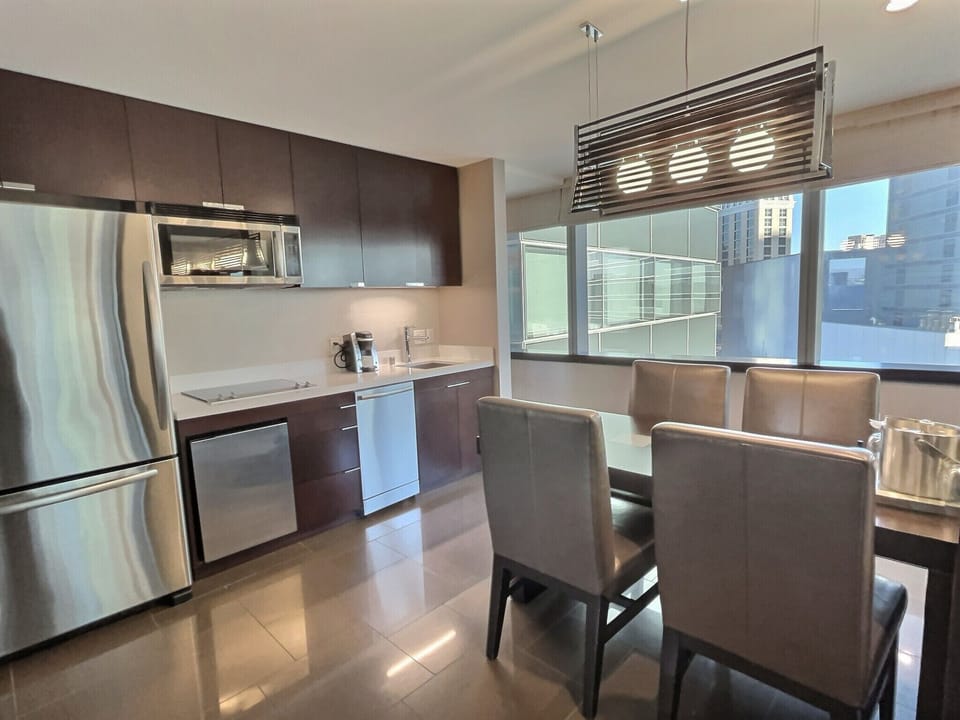 Microwave, stovetop, dishwasher, dining tables