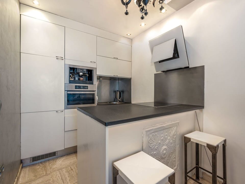 Property, Cabinetry, Interior Design, Kitchen, House, Floor, Kitchen Stove, Flooring, Wood, Major Appliance