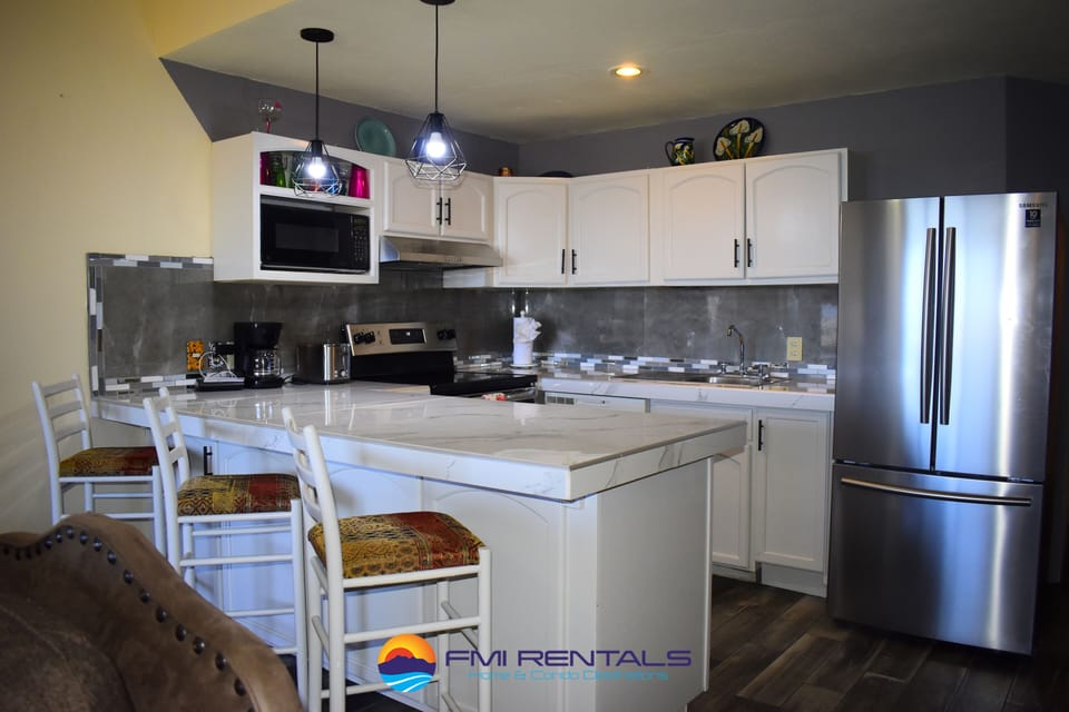 Full kitchen with basic appliances and cookware