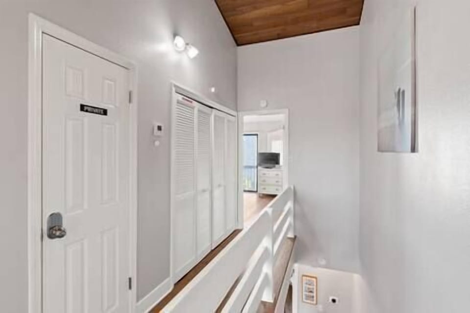 Upstairs hallway. Laundry (full-size washer and dryer) are located in bi-fold closet area. 