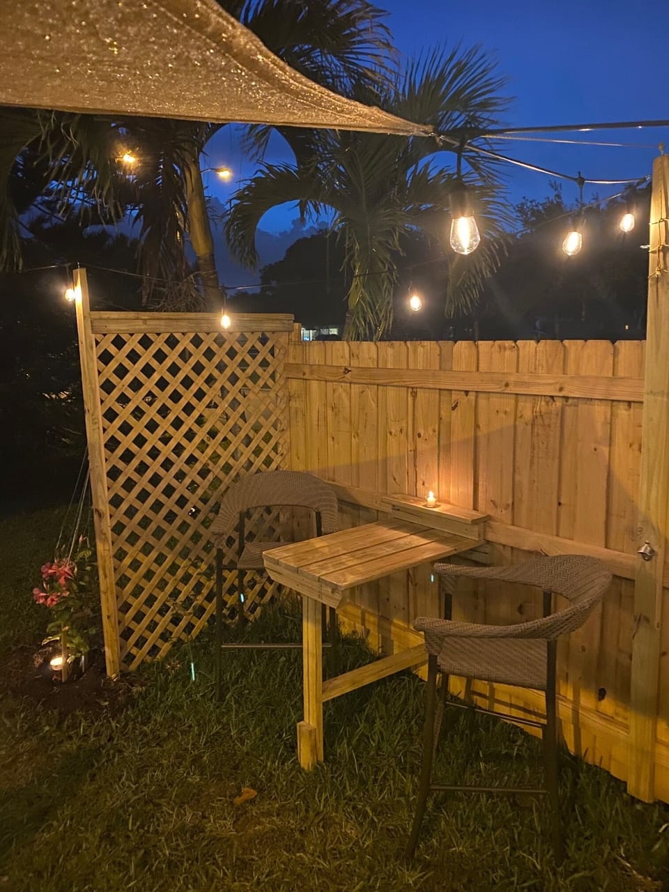 The built in two seater is right next to the jasmine plant.
