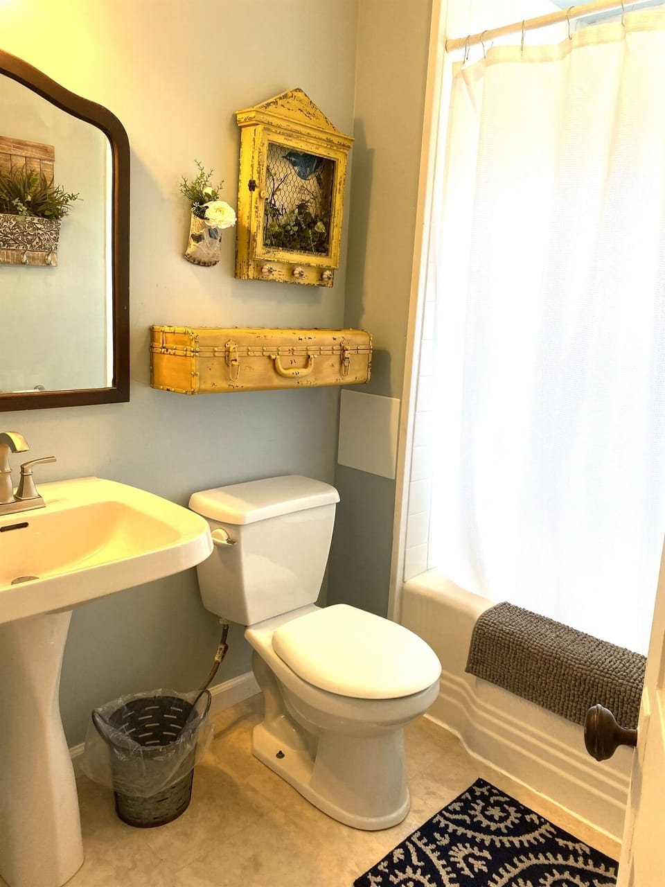 Main floor full bath with shower over bathtub