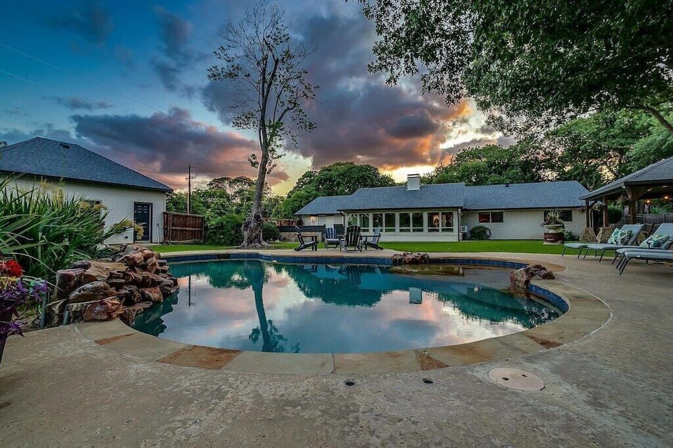Private backyard resort at sunset — pool, veranda & total privacy.