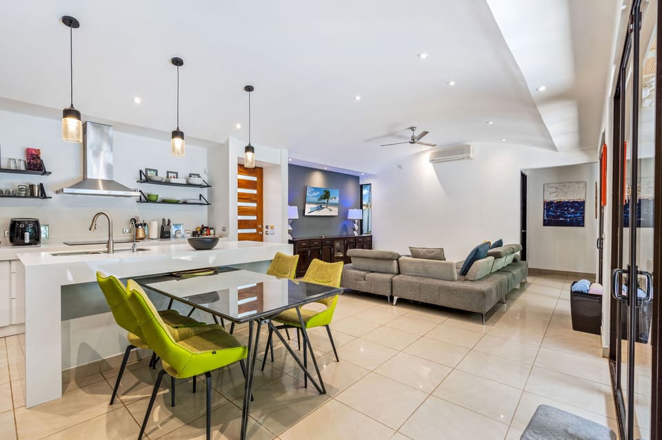 ç

The spacious well lit living area with large glass sliding window doors

