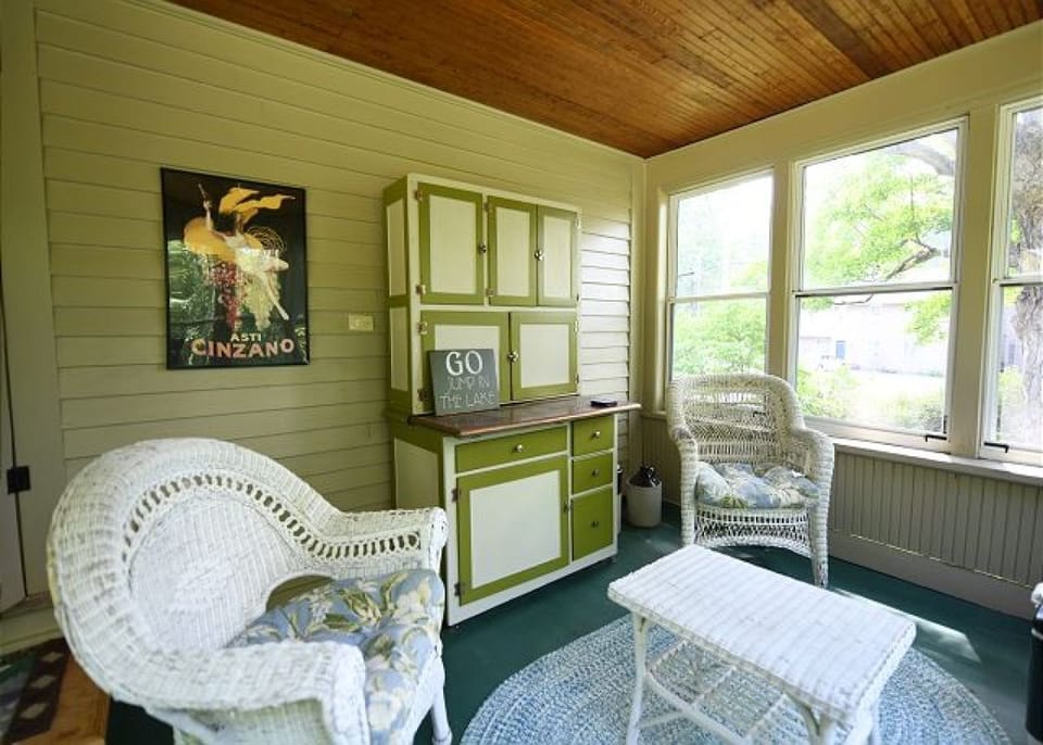 Screened in Porch off of downstairs Primary Bedroom with view of Highland Lake