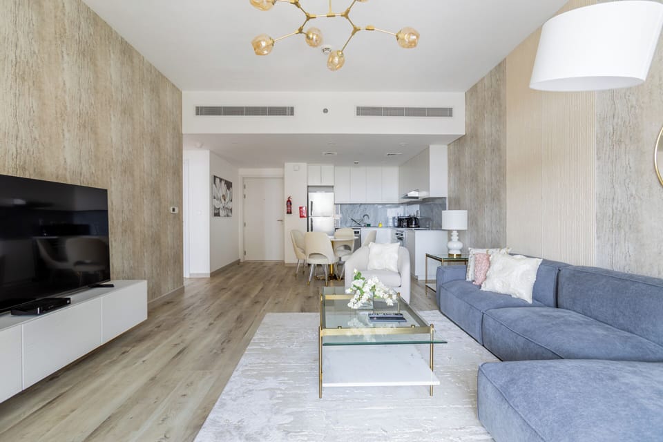 Deluxe Apartment | Living area | 55-inch flat-screen TV with cable channels, TV