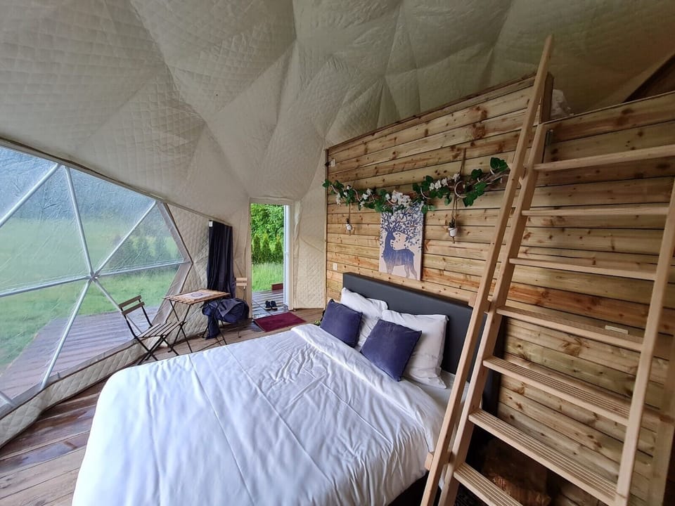 Deluxe Tent | Premium bedding, down comforters, individually decorated