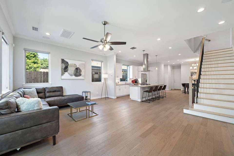 Enjoy lounging w/family and friends in the 1st floor living room furnished with a large sectional.