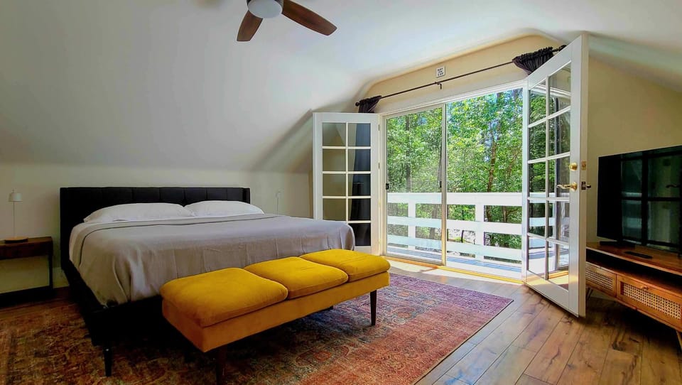 The large master bedroom opens up to a balcony.