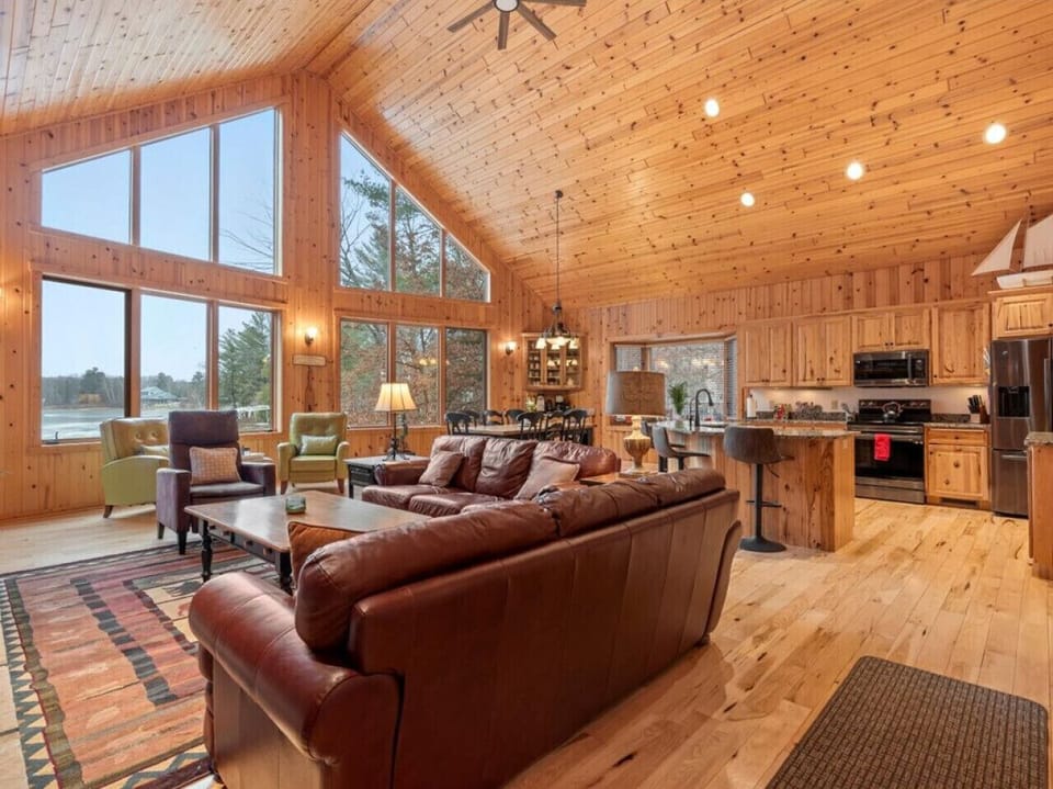 Large floor-to-ceiling windows offering scenic views from the living area.