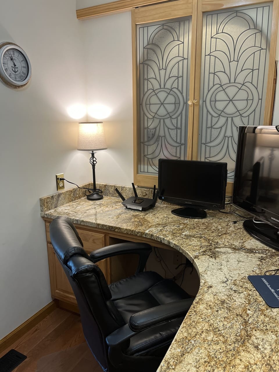 Office space with WiFi and large monitors.