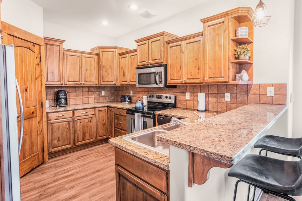 Large kitchen with plenty of pantry storage.