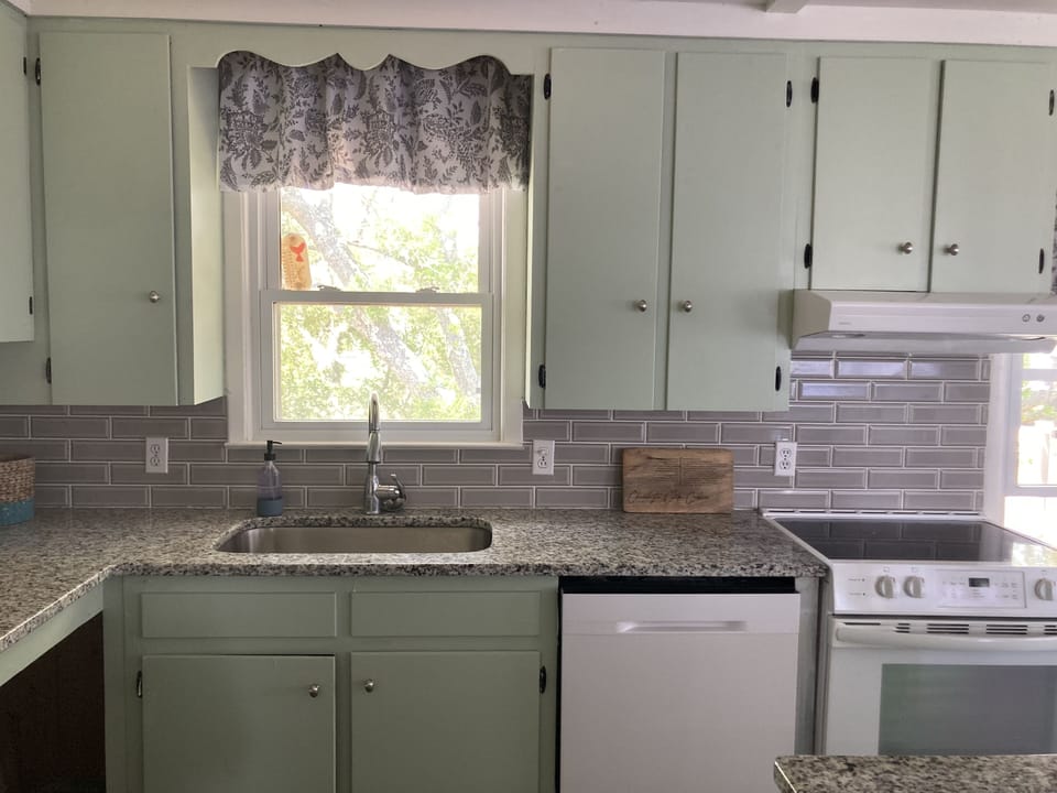 Kitchen with dishes and cooking basics. 
