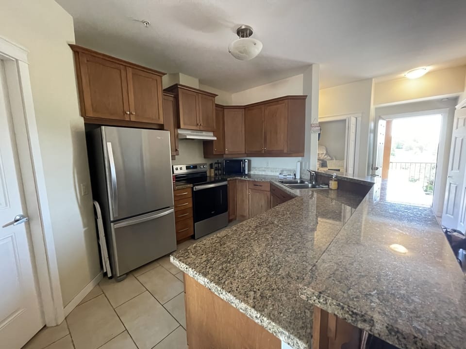 New stainless fridge and stove, granite countertops, dishwasher, microwave.