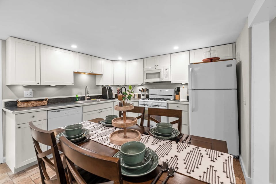 Bright, fully equipped kitchen and dining area with everything you need to enjoy meals together during your stay.
