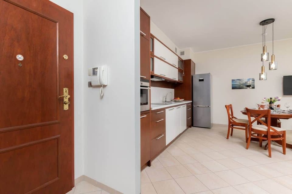 Kitchenette with oven and refrigerator. 
