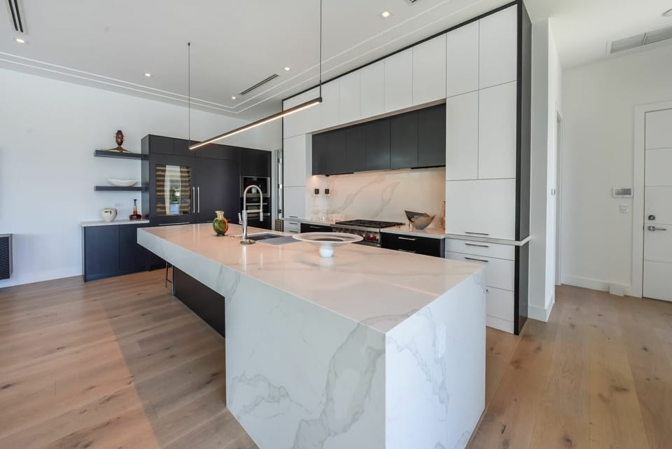 Modern, open plan kitchen is fully equipped for your stay