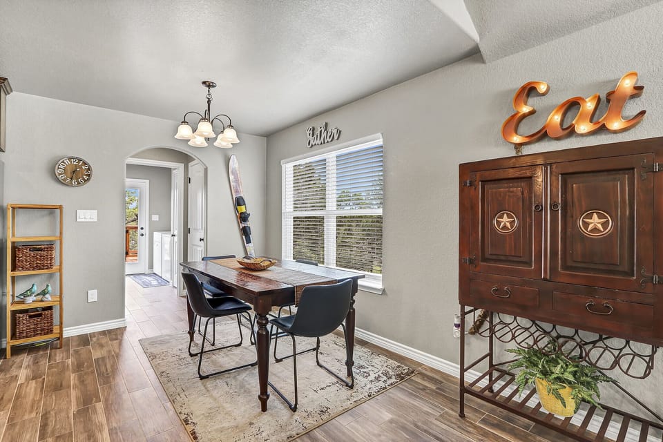 Dining table and view to laundry room.