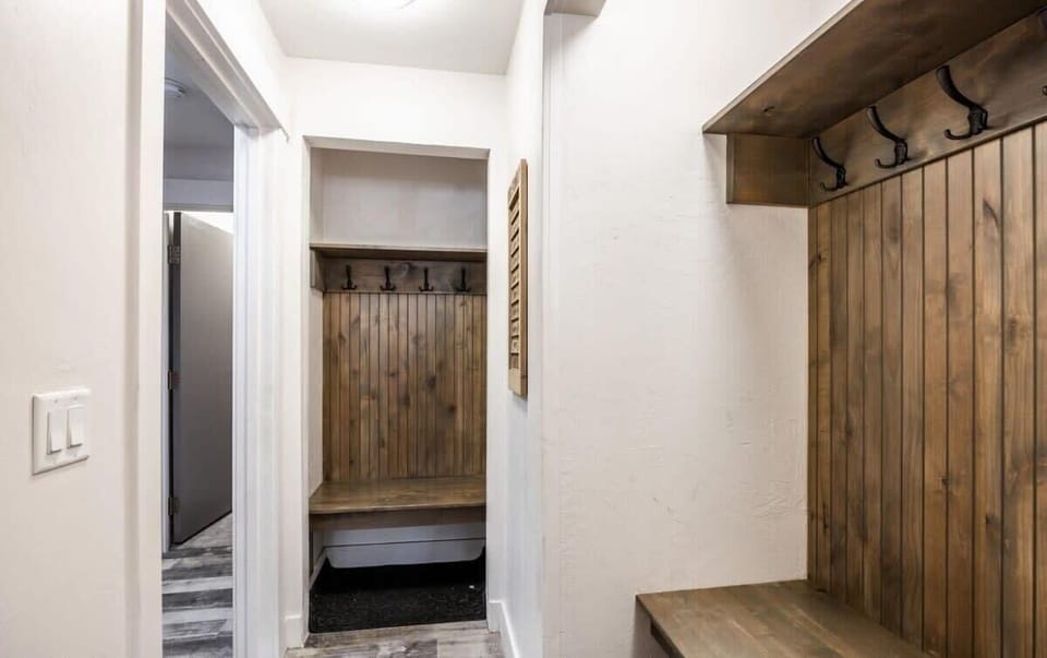 Loads of storage space is available for your gear in two convenient mudroom/cubby spaces in the basement, each with a bench and abundant hooks. A laundry closet is also nearby for your use.