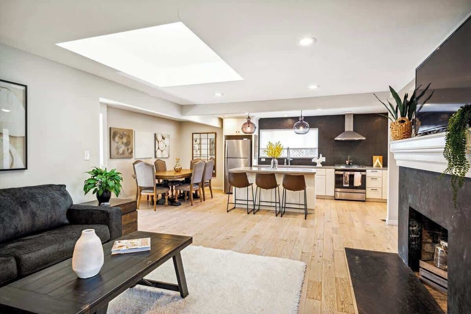 Open and inviting layout with a cozy living area, bright kitchen, and dining space—all designed for easy gathering and relaxed time together.
