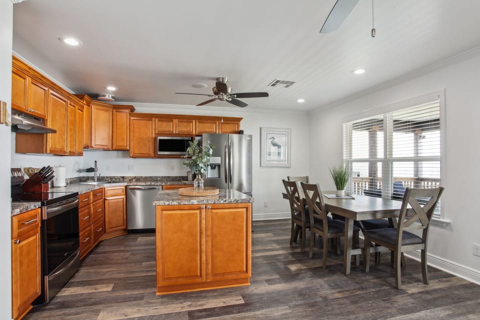 Our fully-equipped kitchen includes a center prep island & loads of storage.