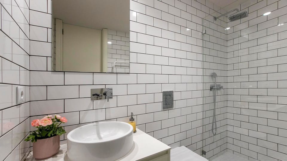 Refresh in the sleek, modern bathroom featuring stylish subway tiles and a spacious rain shower.
#Bathroom #RainShower #LovelyStay