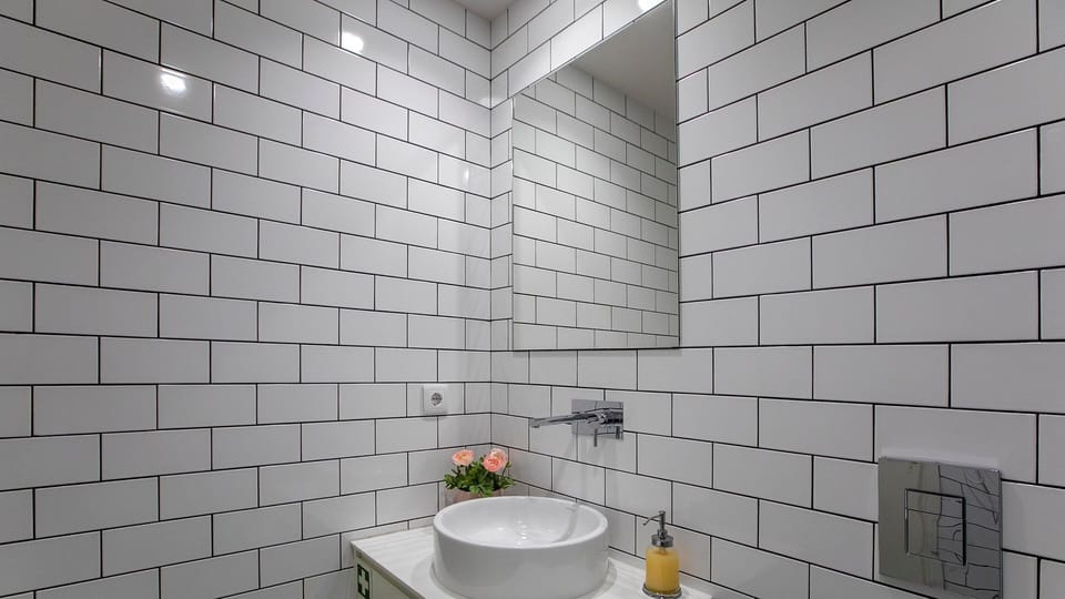 A sleek, modern vanity with a bowl sink and a large mirror, perfect for getting ready in style.
#Bathroom #ModernBathroom #VanitySink #LovelyStay