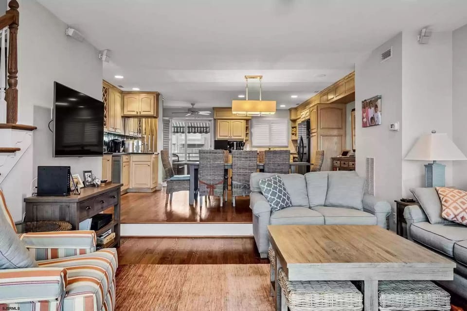 Picture of the living room, kitchen is in the back
