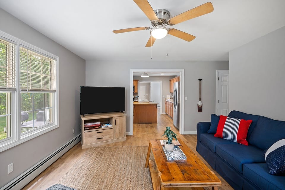 Family room, just off the kitchen. Smart TV & games.