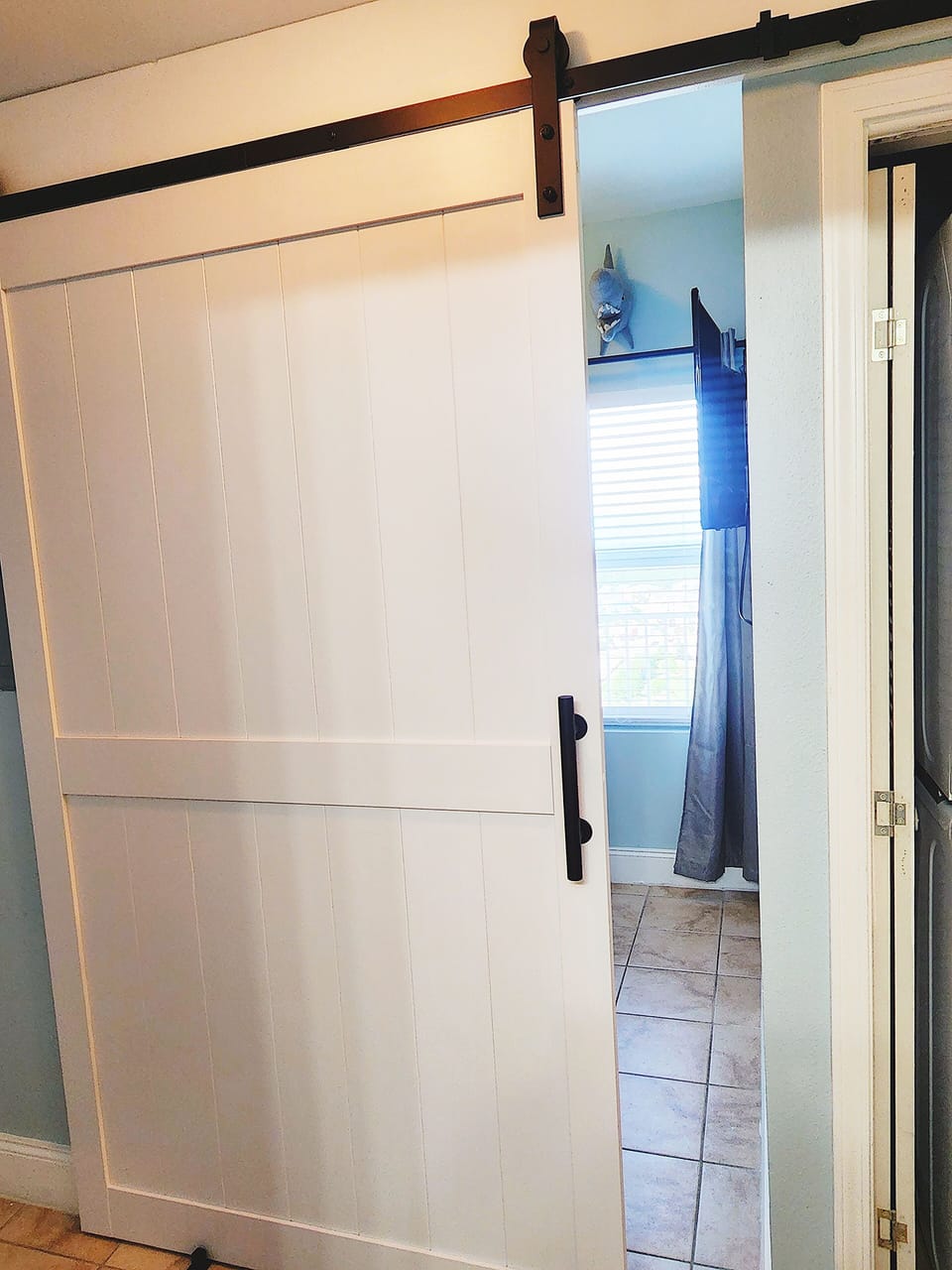 Entrance to the Bunk room area with sliding barn door for privacy