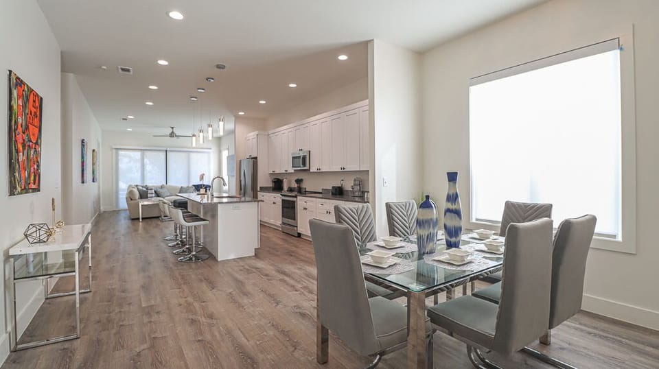 Picture how it all connects — the open floor plan keeps the cook in the conversation and nobody exiled to another room.