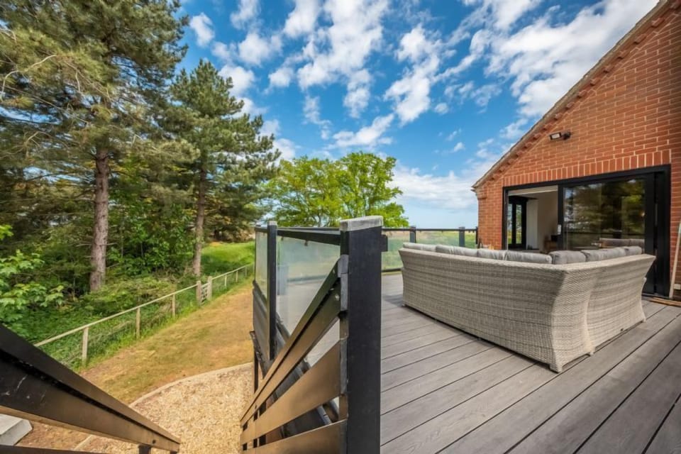 Balcony access down to the rear garden and saltmarsh access