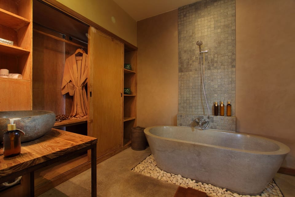 Combined shower/tub, free toiletries, hair dryer, bathrobes