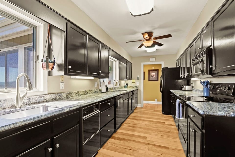Galley Kitchen with Granite Counter Tops