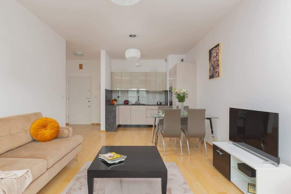 Enjoy your favorite shows on the flat-screen television in the elegant living area.