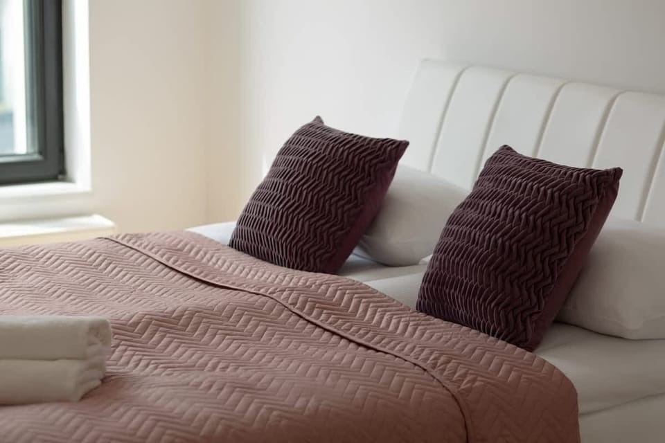 The bedroom's modern design ensures a comfortable stay. 