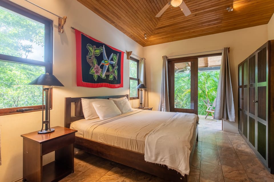Master bedroom with views out to the jungle