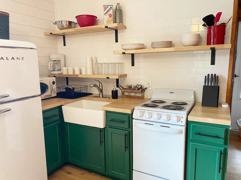 The newly remodeled kitchenette is well stocked.