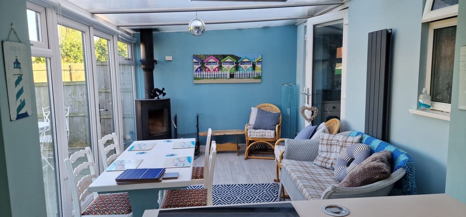 conservatory with dining, seating and wood burner