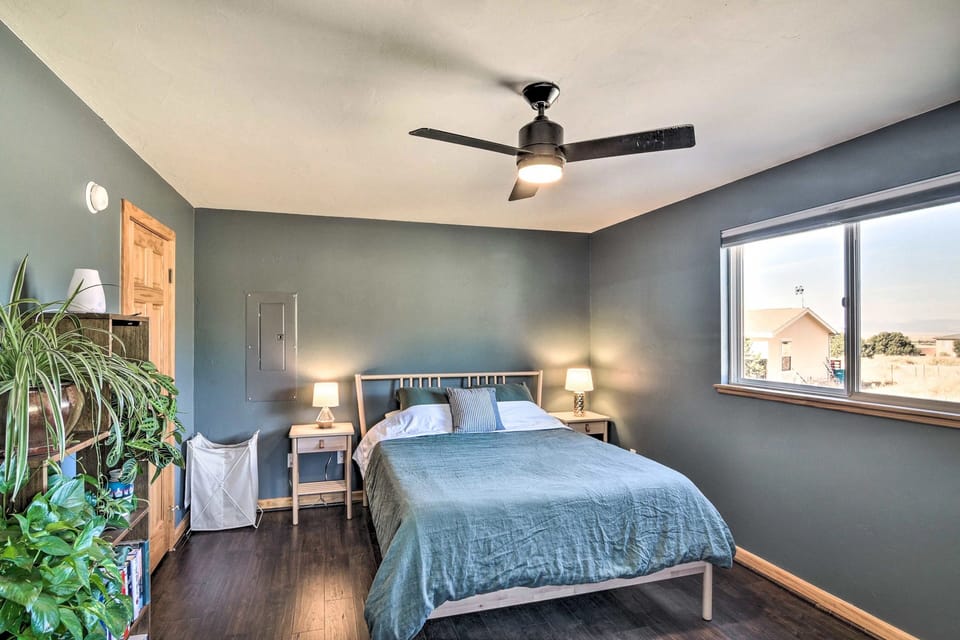Queen bed in the master with its relaxing blue hues.