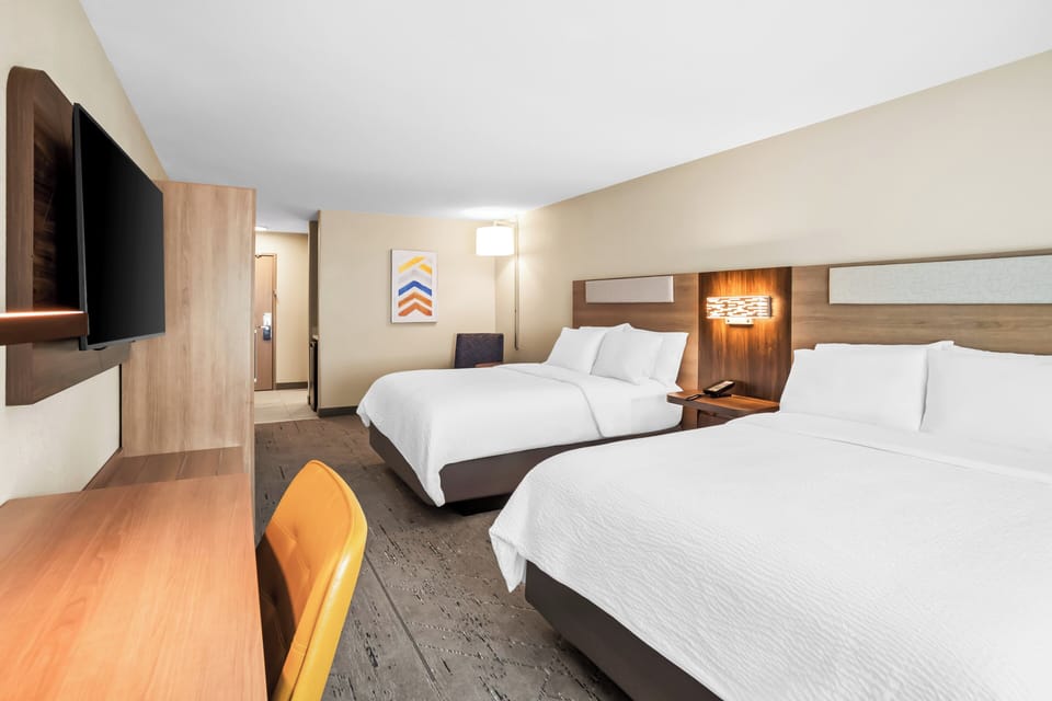 Blackout drapes, iron/ironing board, WiFi (free), alarm clocks